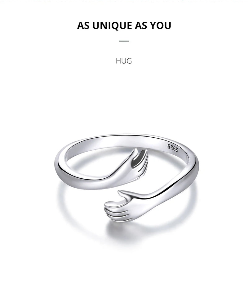 Anel Feminino BAMOER Abraço de Amor – Prata 925 Ajustável | Design de Mãos Entrelaçadas – 3 Cores Elegantes"